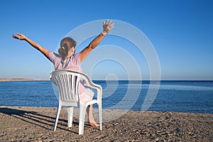 Girl relaxing at resort beach