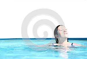 Girl relaxing in swimming pool