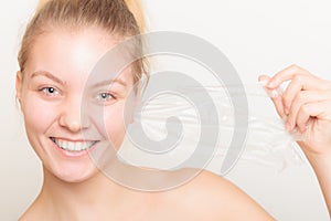 Girl removing facial peel off mask