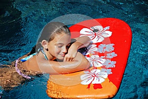 Girl Resting on a Boogie Board