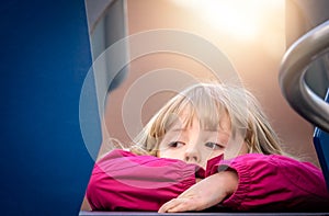 Girl resting on an outdoor slide