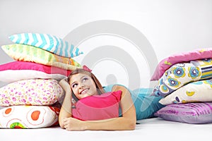 Girl resting on pillows photo