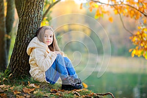 A girl rests in a beautiful park