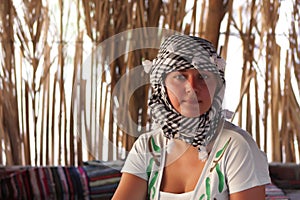 Girl rests in Bedouin tent