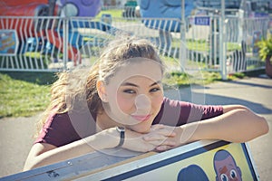 Girl Rests Head on Bench