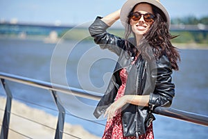 Girl rests on the river in the city