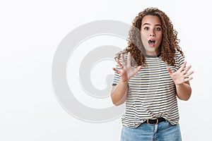Girl retelling thrilling news saying you would not believe. Impressed excited attractive chubby girlfriend curly-haired photo