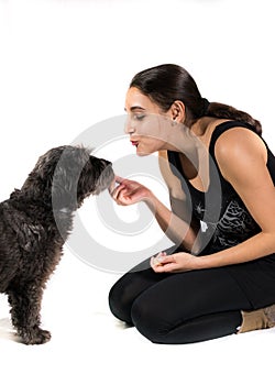 Girl rewarding dog