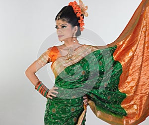 Girl in rich silk green sari