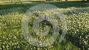 Girl ride bike at green grass meadow. Rural nature landscape Active sport recreation. Blossom flower