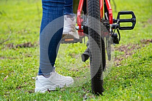 Girl rides an electric bike in the spring forest in Ukraine in the city of Dnipro, outdoor