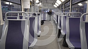 Girl rides a tram wearing a mask. Slow motion