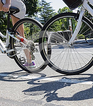 Girl riding bicycle in Central Park, NY, USA