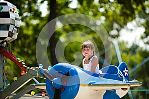 Girl riding carousel