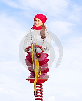 Girl riding on a carousel