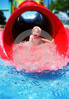 Girl riding down the water slide