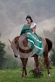 Girl riding equestrian classicism dress photo