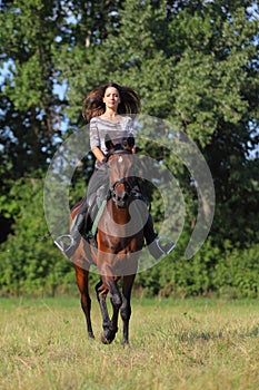 Girl riding her Trakehner horse