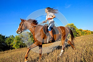 Girl riding a horse