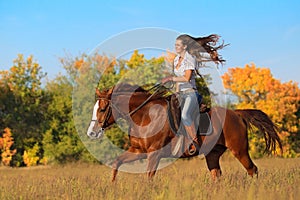 Girl riding a horse