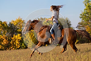 Girl riding a horse