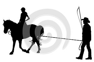 Girl riding on the horse with her trainer