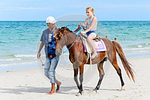 Girl riding horse.