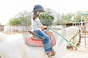 Girl Riding Horse For Physical Development