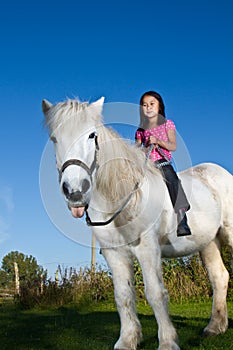 Girl riding a icelandic horse