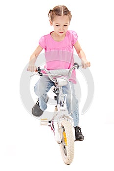 Girl riding kids bike
