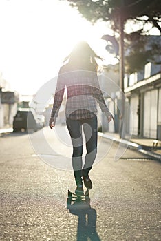 Girl riding on a longboard