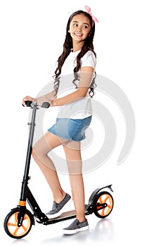 Girl riding a scooter