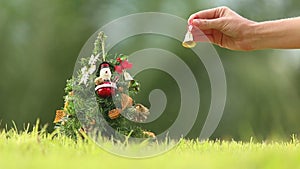 Girl Rings a Bell Neer the Christmas Tree