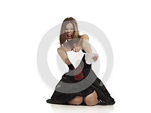 Girl ripping up a piece of paper