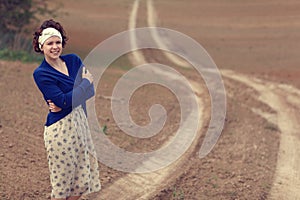 Girl on the road in field