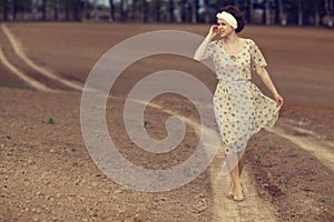 girl on the road in field