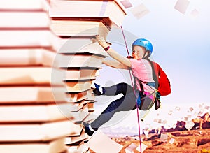 Girl rock climb on the mountain of knowledge books