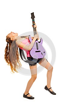 Girl rocks while playing on electro guitar