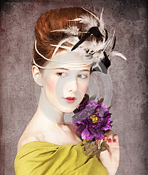 Girl with Rococo hair style and flower photo