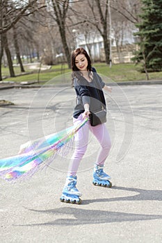 Girl in roller skate in the street.