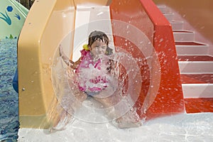 Girl rolling waterhills in the pool