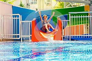 Girl rolls on the water slide