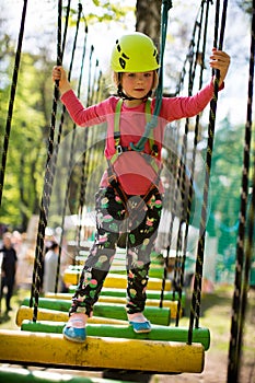 Girl in ropes course adventure park