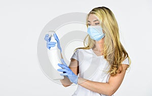 Girl in rubber gloves spray with cleaner detergent. precautions for coronavirus. covid-19 pandemic quarantine