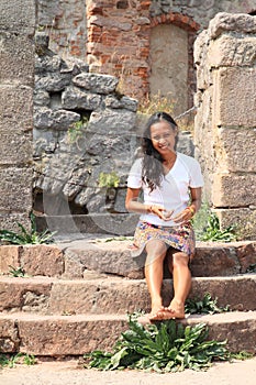Girl in ruins of castle Pecka