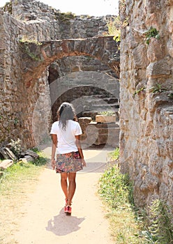 Girl in ruins of castle Pecka