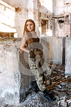 Girl on the ruins with gun
