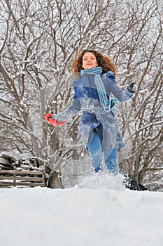 Girl run in winter garden