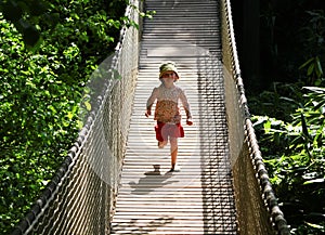 Girl Running Across Bridge