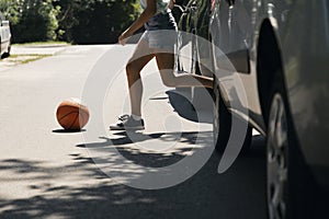 Girl running with ball on pedestrian crossing